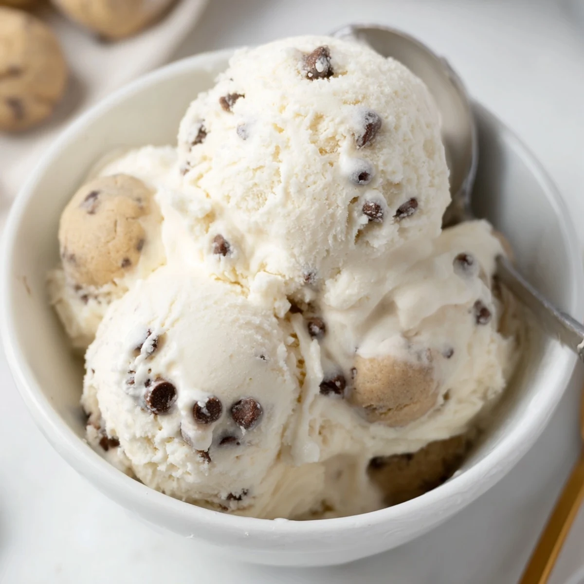Refreshing, protein-rich Cottage Cheese Ice Cream adorned with rich cookie dough pieces.  
