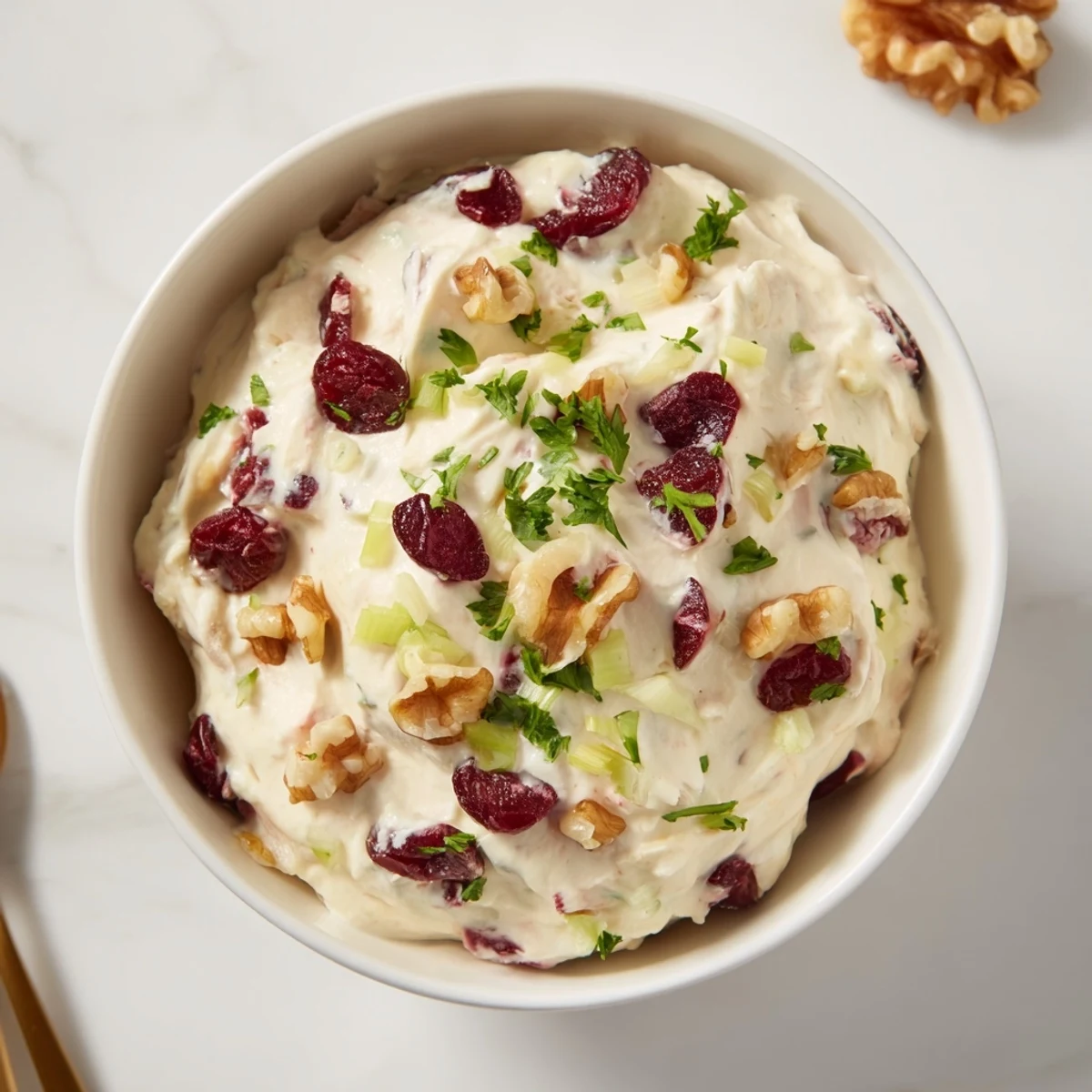 This festive Lightened Holiday Cream Cheese Dip features a swirl of cranberries in a creamy white base, ready to serve.