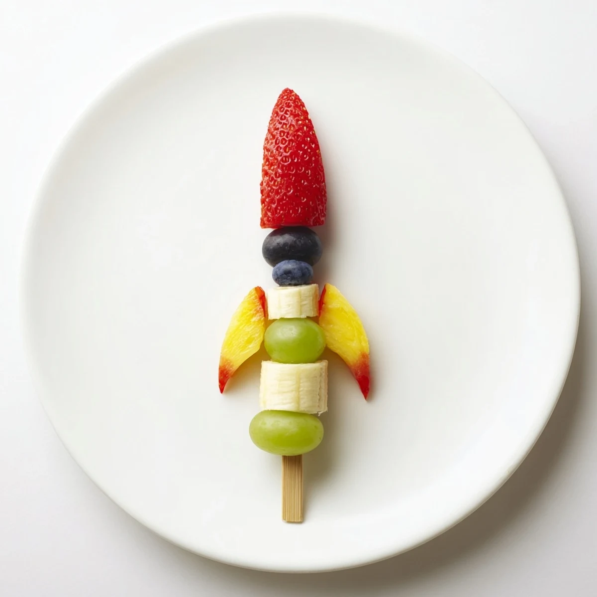 Vibrant Rocket Ship Fruit Skewers with juicy strawberries, perfect colorful snack for kids.