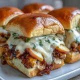 Savory turkey sliders with sharp cheddar and sweet apple, baked golden brown.