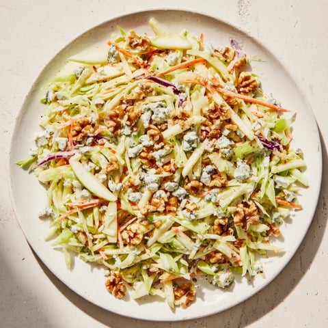 Fresh, crisp Crunchy Apple & Walnut Slaw with blue cheese, a refreshing side salad ready to enjoy.