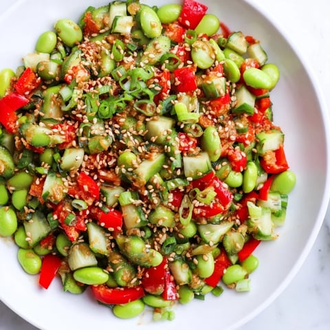 Vibrant edamame salad with crisp cucumber and savory sesame dressing, ready to enjoy.