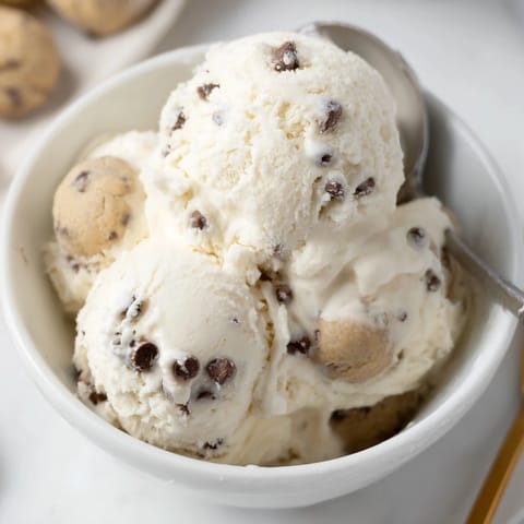 Refreshing, protein-rich Cottage Cheese Ice Cream adorned with rich cookie dough pieces.  