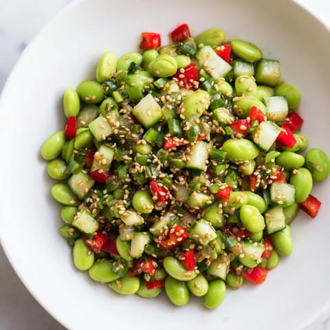 A close-up shot of a colorful edamame salad bowl, perfect for a light Asian-inspired meal.