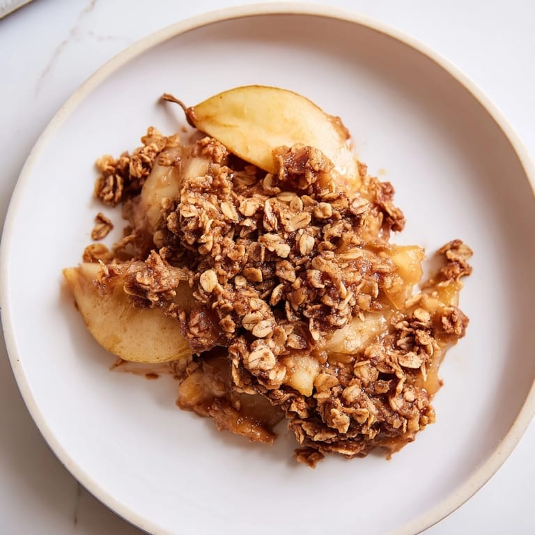 Close-up of the Cinnamon Caramel Pear Crumble, showcasing the buttery oat topping.