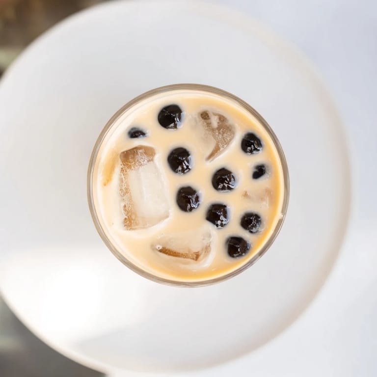 Enjoy a vibrant picture of this rich Boba Tea Hack recipe, featuring luscious tapioca pearls swirled in milk.