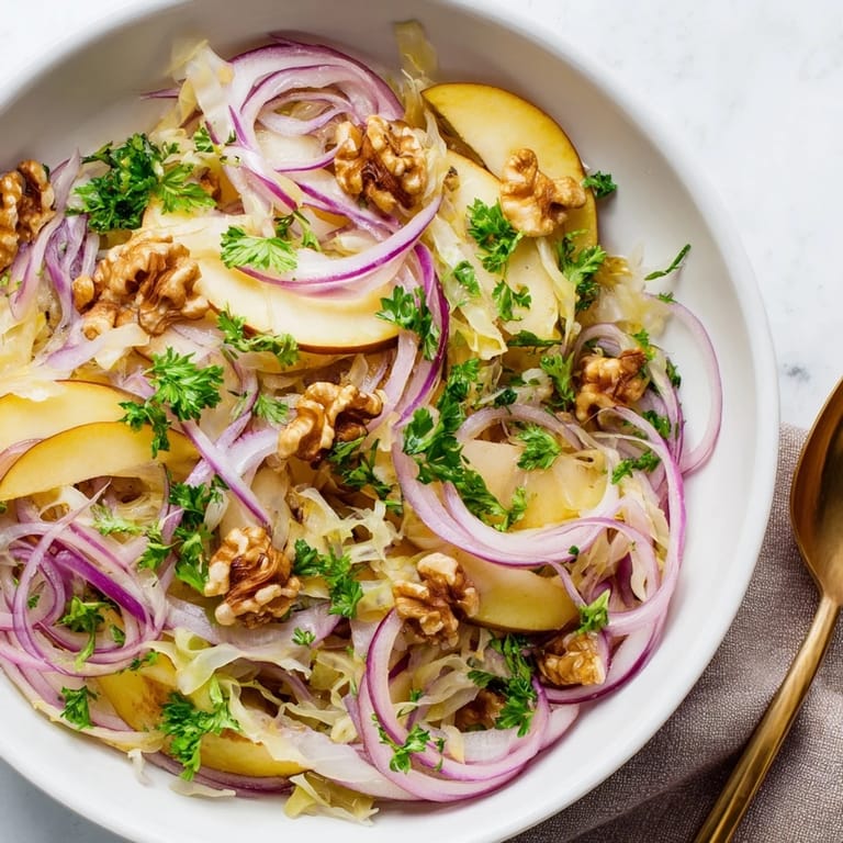 Colorful glazed apples and probiotic sauerkraut in a warm skillet, ready to be served over fluffy rice or greens.