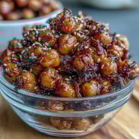 Crispy chili garlic chickpeas served over fragrant jasmine rice with sesame seeds and scallions.  