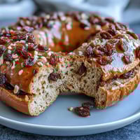 Golden, chewy cinnamon raisin bagels with Greek yogurt, packed with protein and sweet raisins, perfect for a healthy breakfast or snack.  